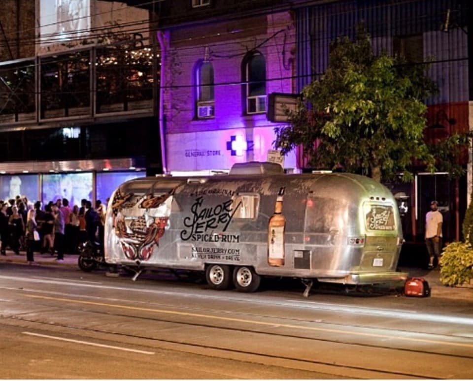 Alcohol brand activation, the Airstream wrapped as a styled festival bar